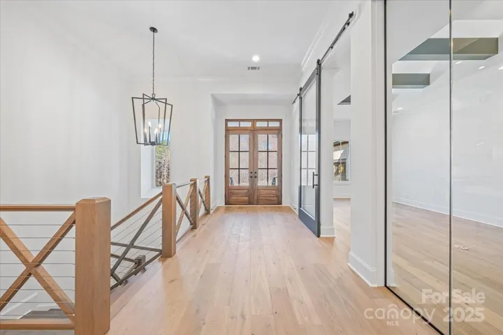 Foyer and Den with Glass Corner Detail
