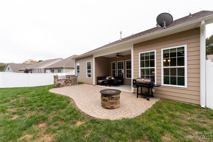 Backyard with firepit and in ground gas grill