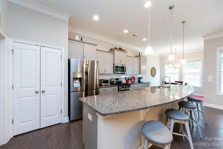 Kitchen featuring granite counter tops & stainless appliances