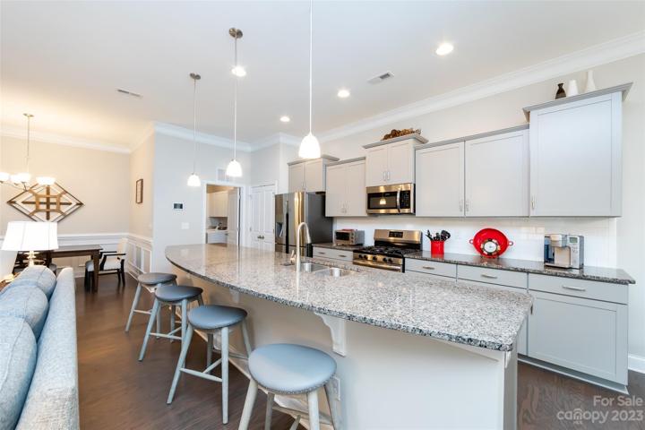Kitchen featuring granite counter tops & stainless appliances