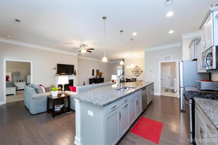 Kitchen featuring granite counter tops & stainless appliances