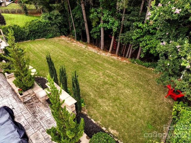 private backyard that has a nice wooded area below