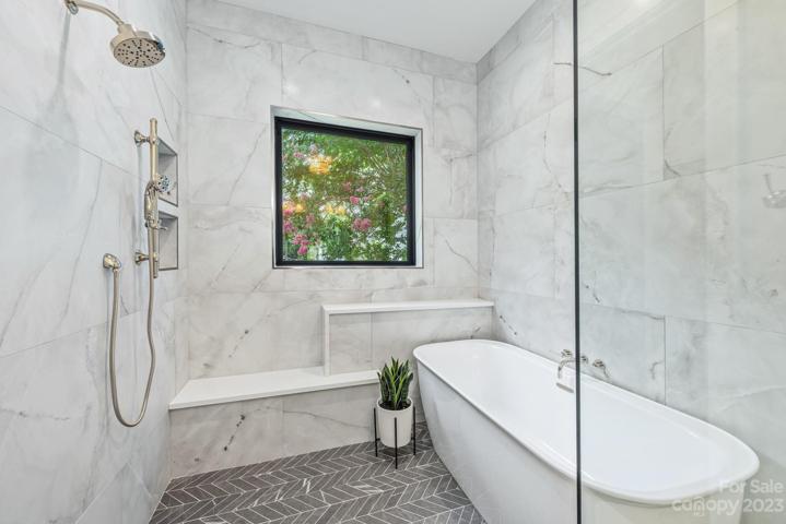 Primary bathroom with walk in shower and garden tub