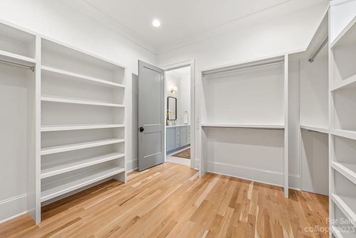 Large walk in primary closet with washer and dryer hookups