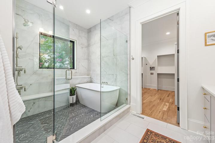 Primary bathroom with walk in shower and garden tub