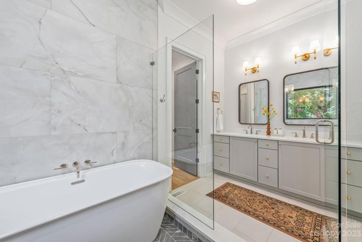 Primary bathroom with walk in shower and garden tub