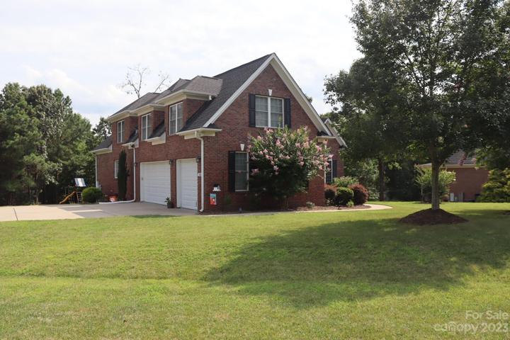 Side view of the home with 3 car garage - with garage door openers.