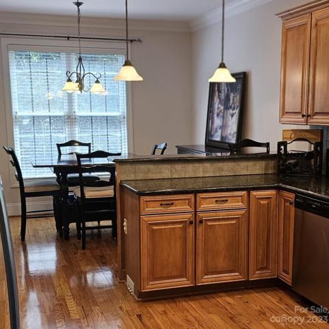 Kitchen with raised bar area for snacks and a breakfast area