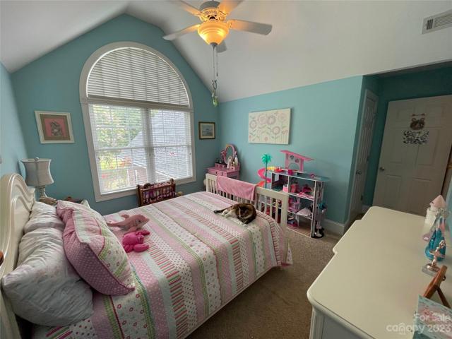 Bedroom 3 upstairs with huge palladium window.