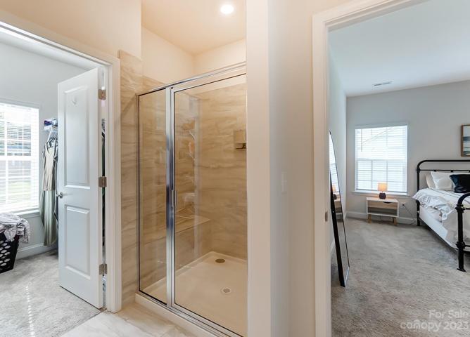 Primary Bath with dual vanity, quartz counter tops, and shower