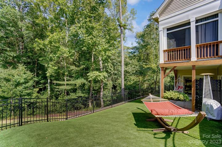 Fully fenced backyard space w/astro turf, great for kids or pets!