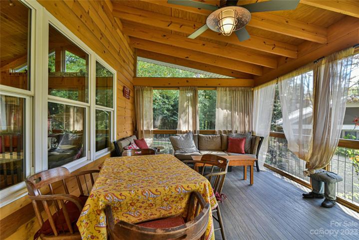 guest cabin screened in porch facing the lake