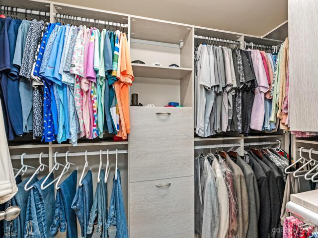 2nd Flr - Primary custom WIC closet off bath; 4 laundry hampers