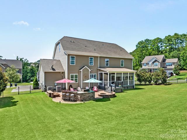 Rear View of property, fenced w/wide gate, in-ground irrigation