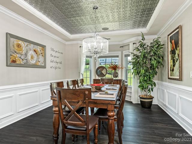 1st Flr - Formal Dining w/punch tin, in-ceiling speakers & controller