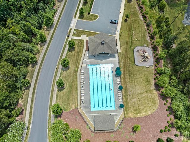 Aerial of community Pool, Cabana, Restrooms, Playground and Parking lot