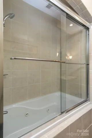 Guest bath jetted tub and shower.