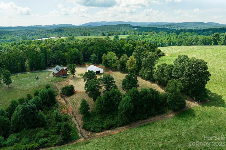2.21 acres, with 1 acre fenced pasture and 40 x 44 pole barn~ Wow!