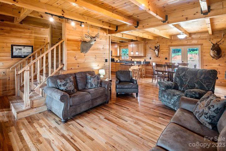 Wow, this family room is a show stopper- check out the gorgeous exposed beam ceilings