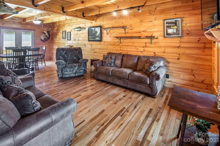 Family room is spacious with gleaming oak floors.