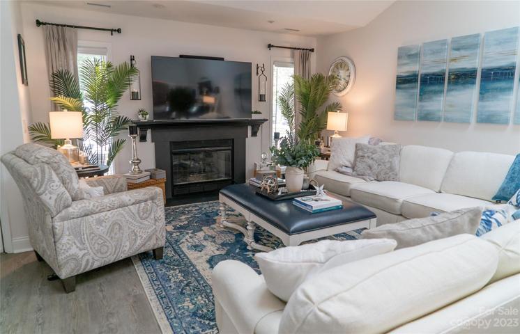 This large tv goes with the property and the gas fireplace provides not only ambiance but heat as wll.