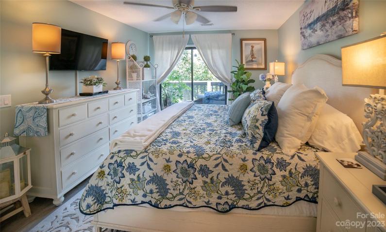 Sliding glass doors enter onto the deck from the primary.