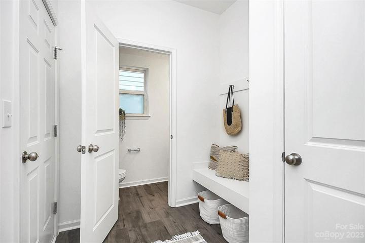 Ample space in from garage.  Drop those bookbags & work shoes!  Storage closet for coats, drop zone for stuff & powder room.