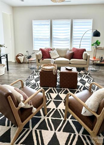 Spacious & open living room also offers plenty of wall space.  Get the big screen up in time for football season.