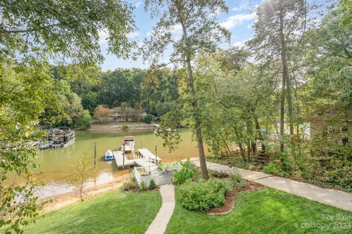 Cove-side dock offers privacy from the busy main channel, with over 26 feet of deep water access!