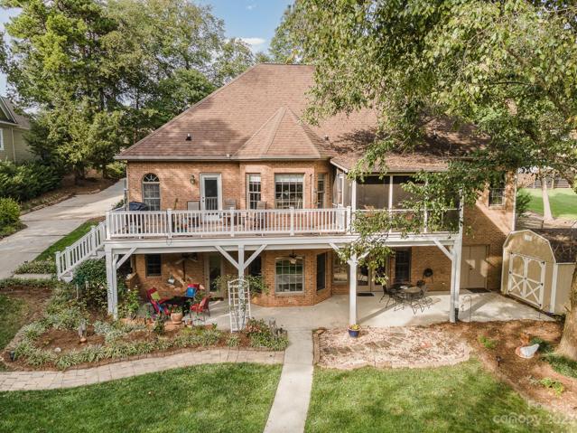 Natural tree-lined foliage surrounds this lake home for added privacy!