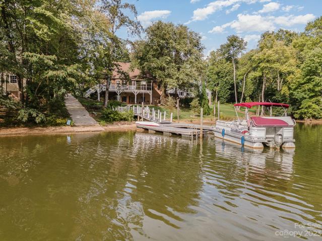 Cove-side dock offers privacy from the busy main channel, with over 26 feet of deep water access!