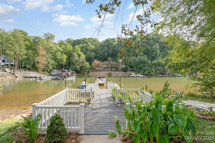 Cove-side dock offers privacy from the busy main channel, with over 26 feet of deep water access!