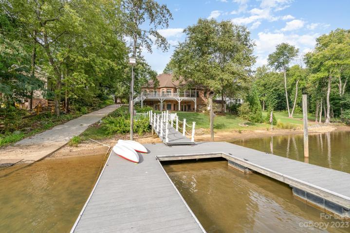 Cove-side dock offers privacy from the busy main channel, with over 26 feet of deep water access!