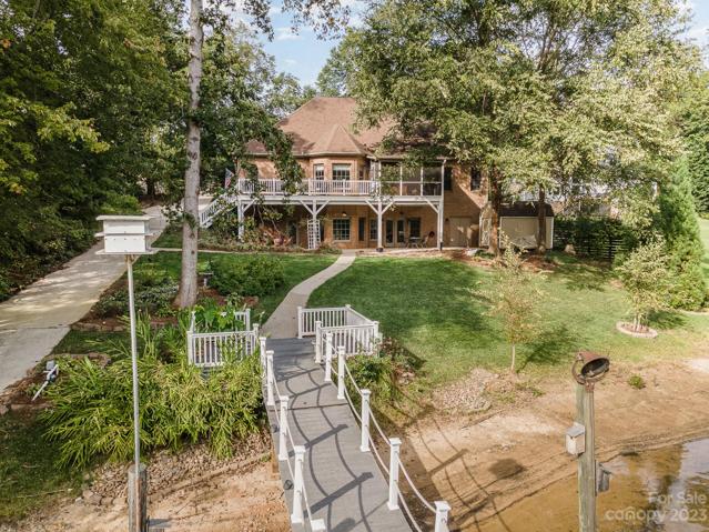 Natural tree-lined foliage surrounds this lake home for added privacy!