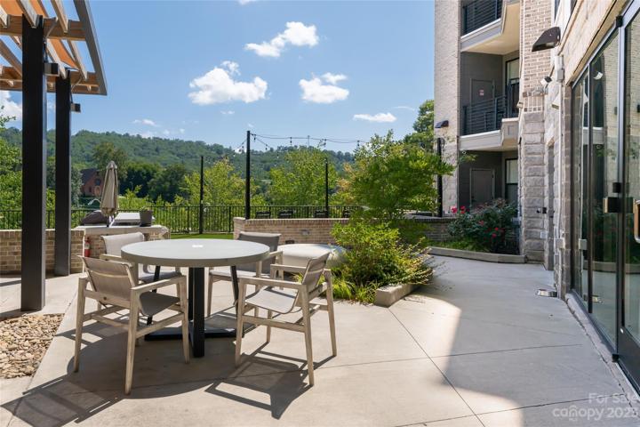 Patio off back of 55 S Market for residents use which includes Fire-pit, Barbeques, seating and covered lounges.
