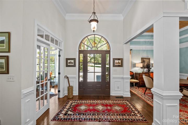Main Entryway outfitted with a custom glass and wood door, installed in 2021
