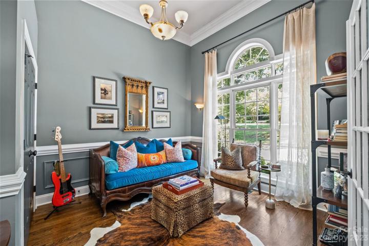 Secondary bedroom, main level, can be used as a bedroom or other.  High ceilings, floor to ceiling windows, freshly painted.