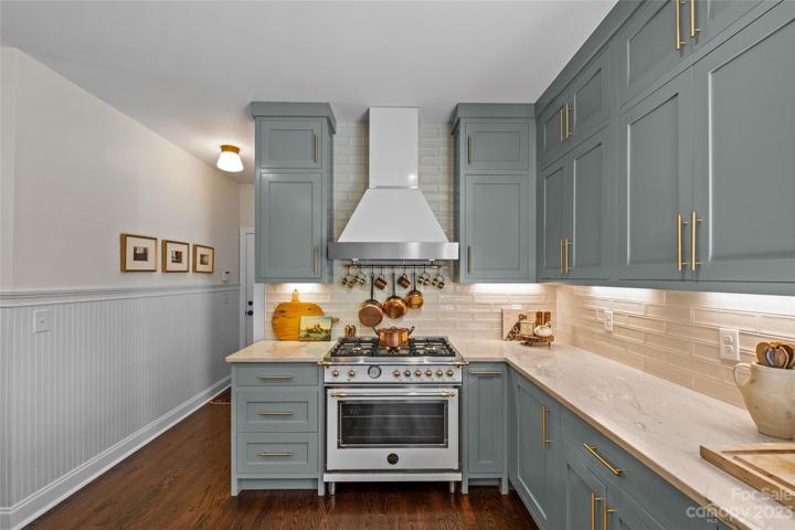 Bertazzoni 36" gas range & cooktop, Italy.  Vented hood, quartzite countertops, tiled backsplash.