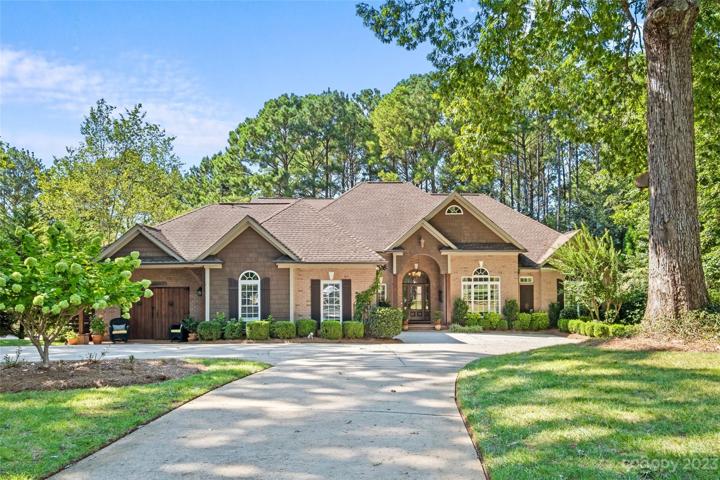 Renovated in 2021, and loved for 23 years, this gorgeous home sits on almost an acre flat lot with a circular driveway and surrounded by beautifully manicured garden and grounds.