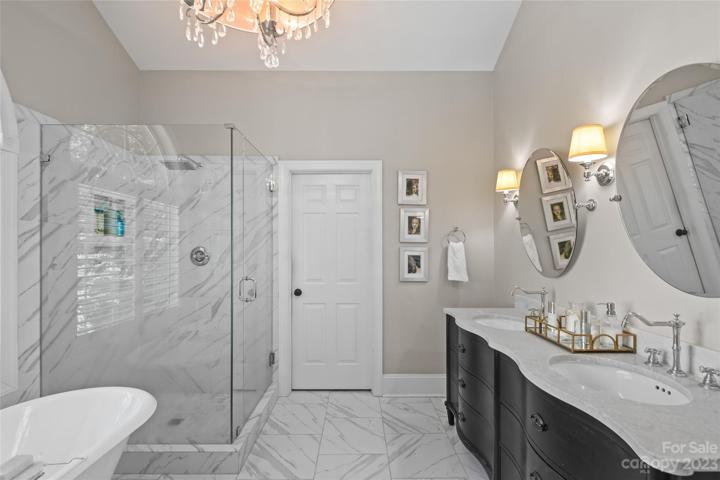 Primary bathroom, leads to a walk-in closet