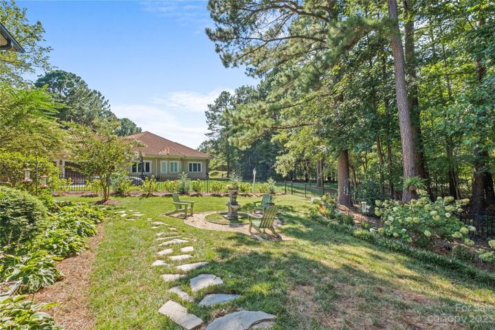 Professionally landscaped back yard oasis outfitted with Boxwoods, Hydrangeas, Gardenias and much more.  Includes a wrought iron fence, landscape lighting and irrigation system.