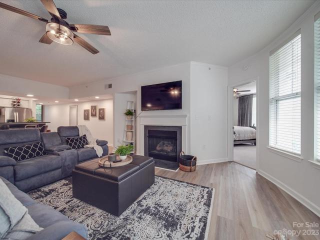 Living room leading into Primary Bedroom 1