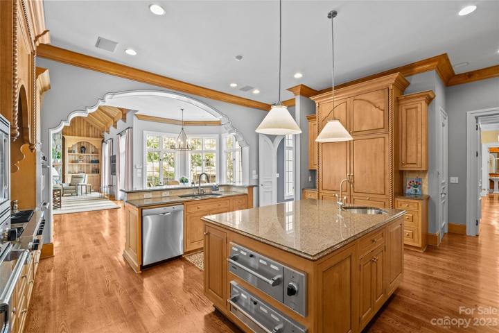 Gourmet chef's kitchen with Viking & SubZero appliances overlooking two-story great room.
