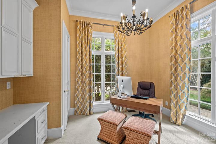 Main floor guest suite usable for home office & more with full bathroom & ample storage.
