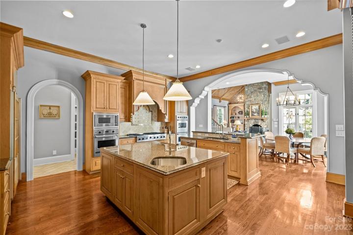Gourmet chef's kitchen with Viking & SubZero appliances overlooking two-story great room.