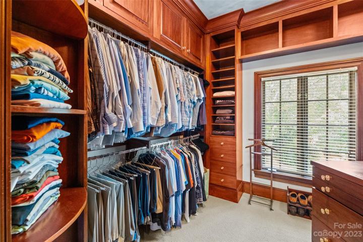 Stunning primary suite with his & her bathrooms, heated floors, walk-in closets & covered balcony overlooking the incredible resort pool & private backyard.