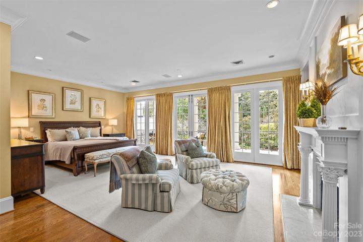 Stunning primary suite with his & her bathrooms, heated floors, walk-in closets & covered balcony overlooking the incredible resort pool & private backyard.