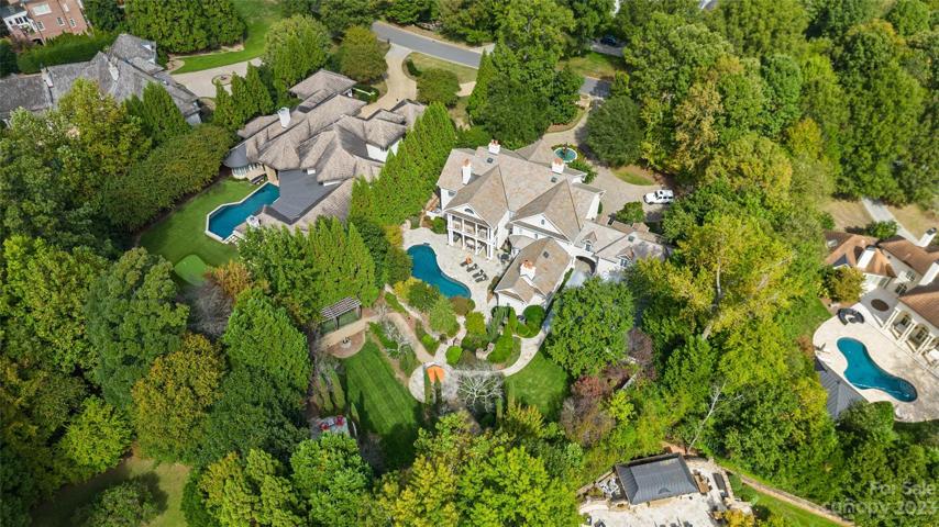 Located on a picturesque private 1.1 acre lot in the exclusive gated community, Morrocroft Estates, 4424 Fox Brook Lane is a one-of-a-kind estate featuring 9,149 square feet, 6 bedrooms, 8 full & 2 half bathrooms with 5 fireplaces.