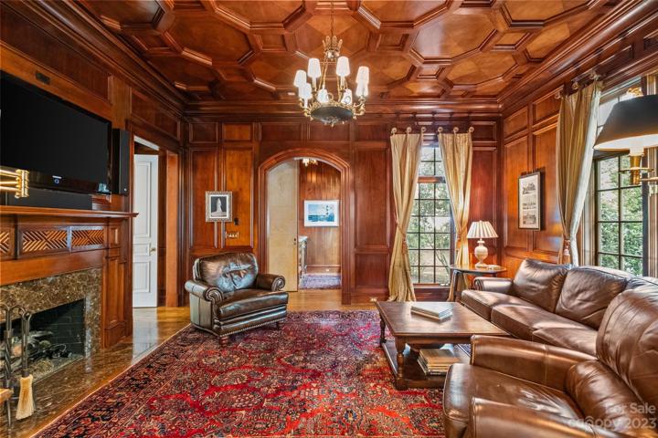 Study with mahogany wood throughout, builtins, fireplace & wet bar