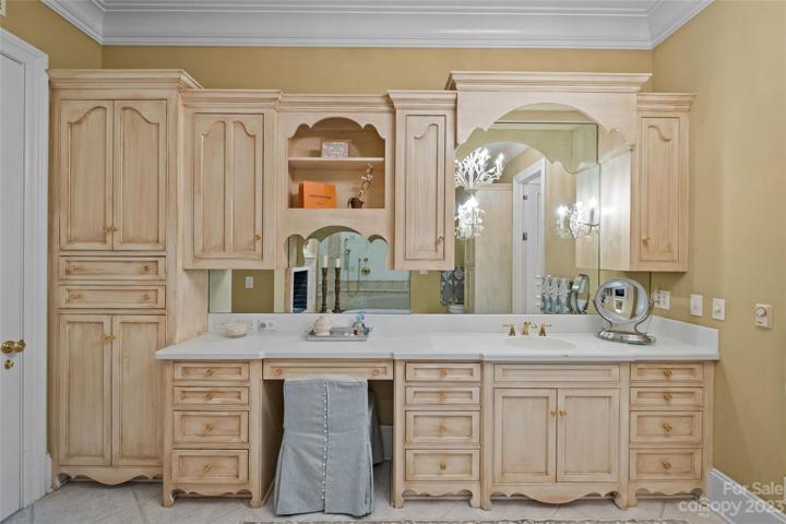 Stunning primary suite with his & her bathrooms, heated floors, walk-in closets & covered balcony overlooking the incredible resort pool & private backyard.